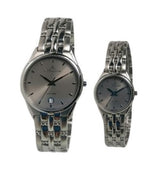 Two silver watches with intricate links on a white background
